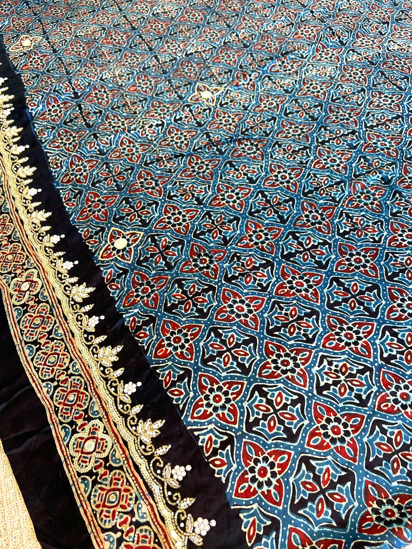 Regal Petals - Pure Modal Ajrakh Hand Embroidered Saree