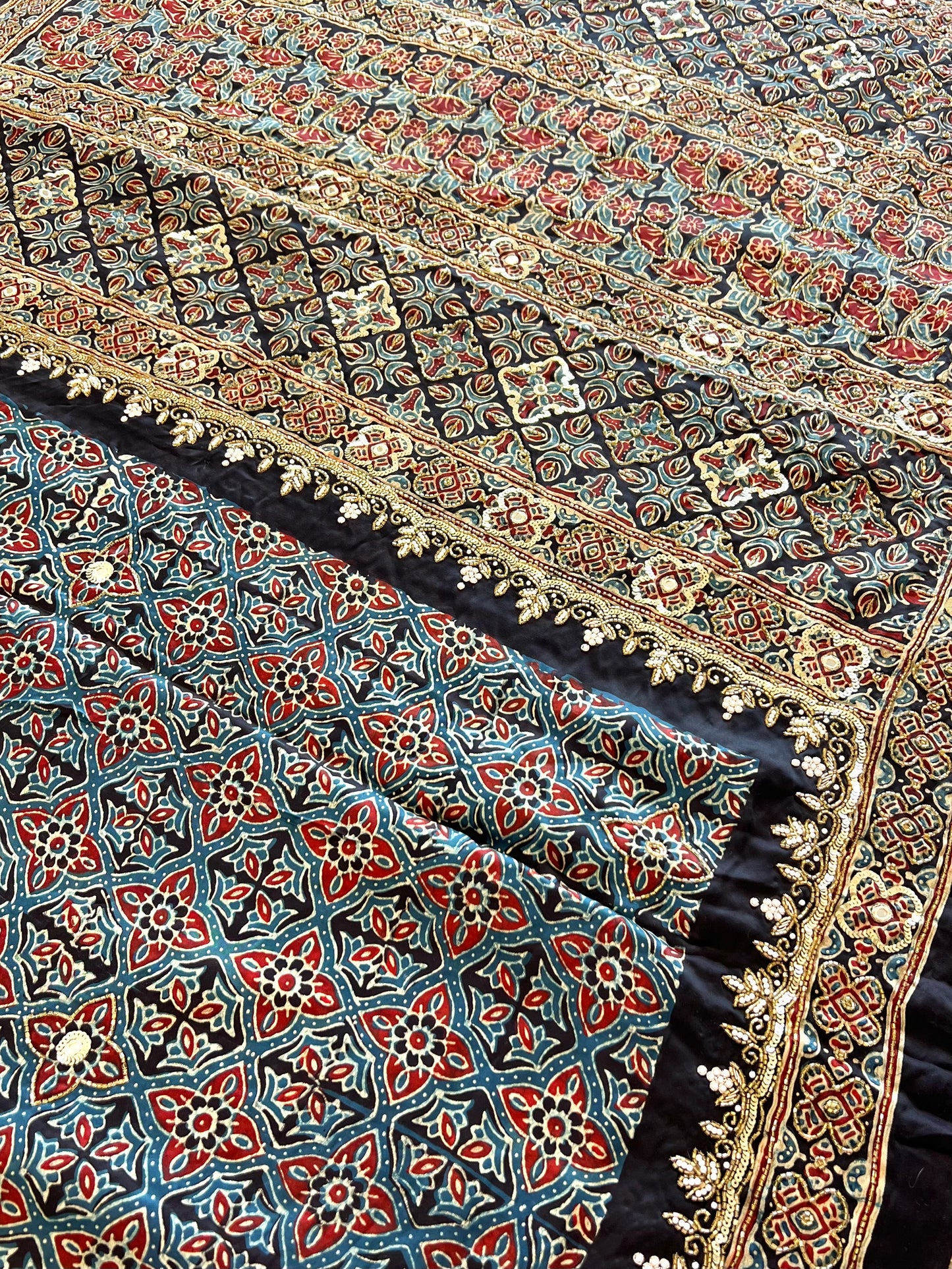 Regal Petals - Pure Modal Ajrakh Hand Embroidered Saree